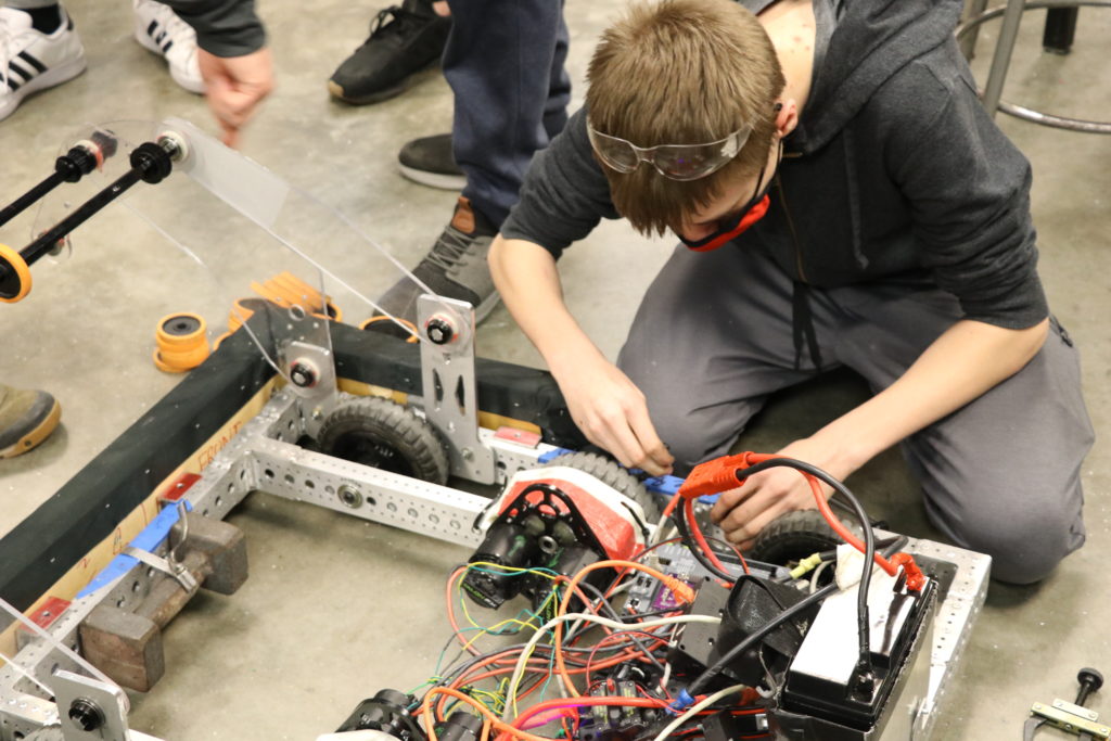 A student working on the drive train.