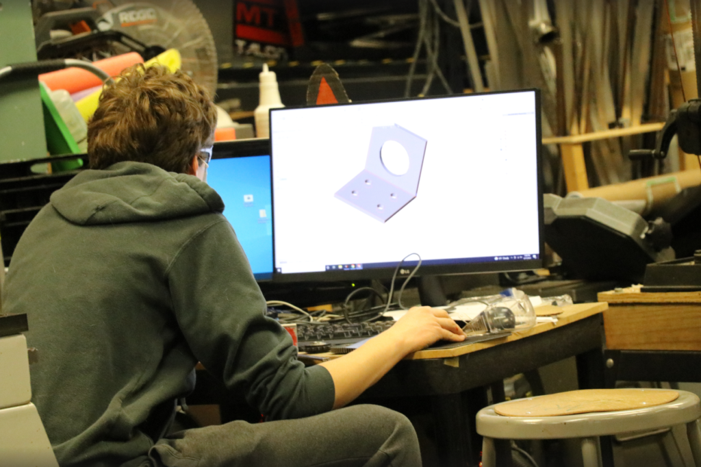 A team member CADing different parts on the CAD computer.