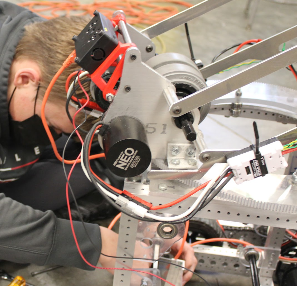 a student working on the turret in the robotics room