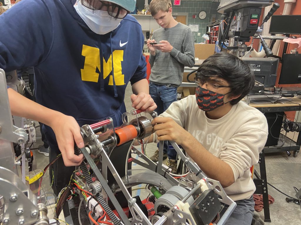 two students working on the robot