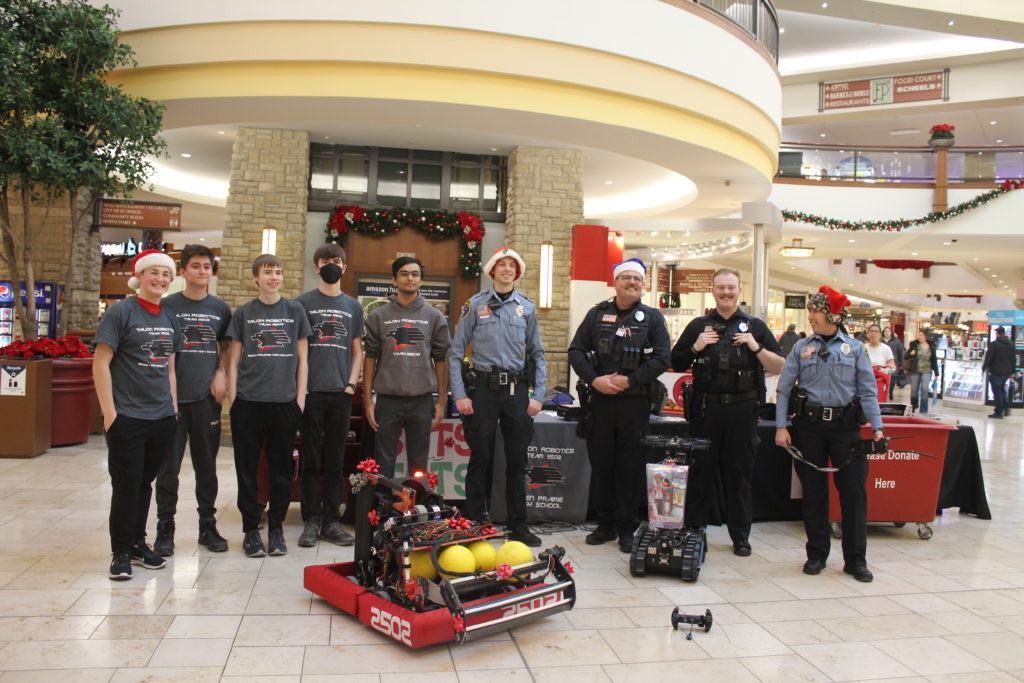 The entire team posing for a picture with the eden prairie police departement