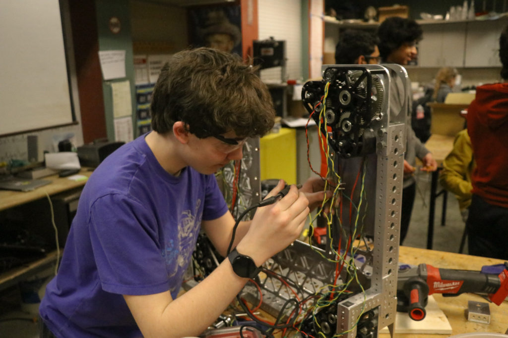 A student working on the electronics
