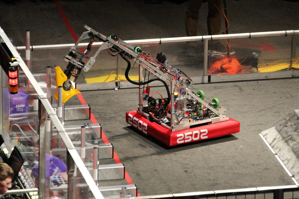robot full extended with its cone being placed