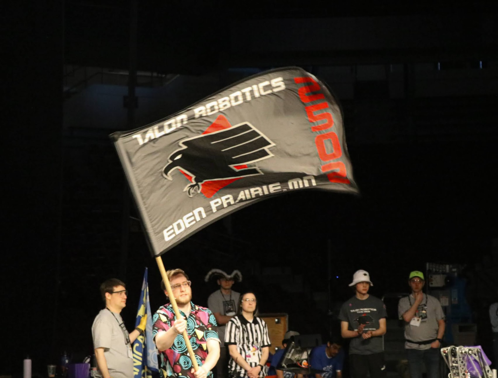 Talon's Flag being used on the match by the announcer. It says "Talon Robotics 2502 Eden Prairie MN"