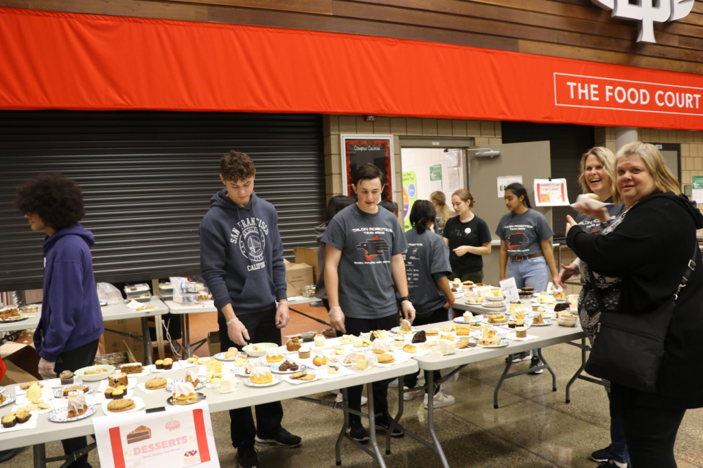 Volunteers handing out desserts