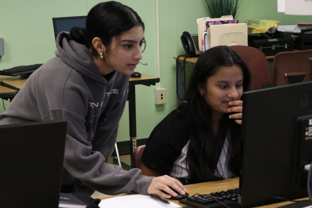 Shruti, our founder helping one of the students with her final coding project.