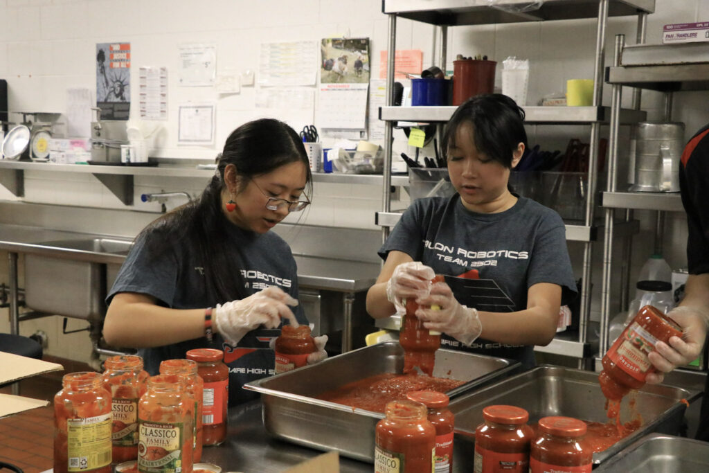 Our student volunteers helping prepare food in the kitchens