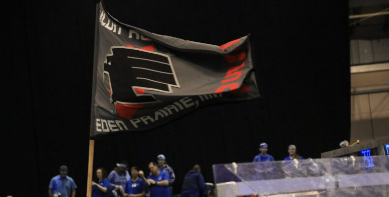 A flag with our logo waving in the air