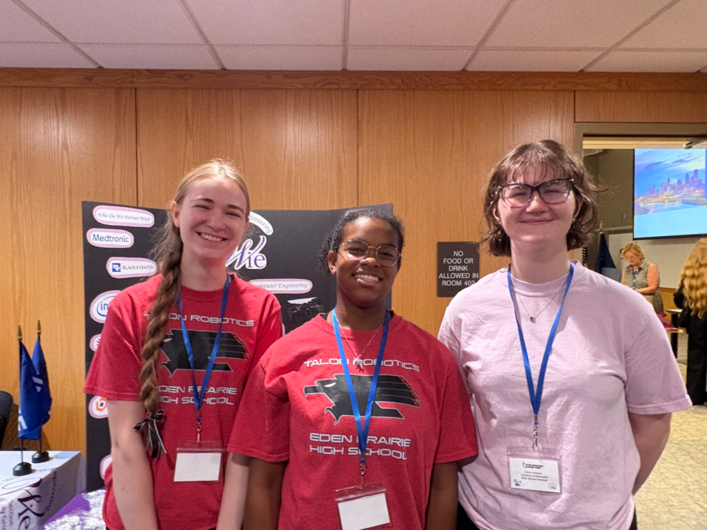 Ally and Brooke-Lynn posing with the head of the U of M's WiELs chapter