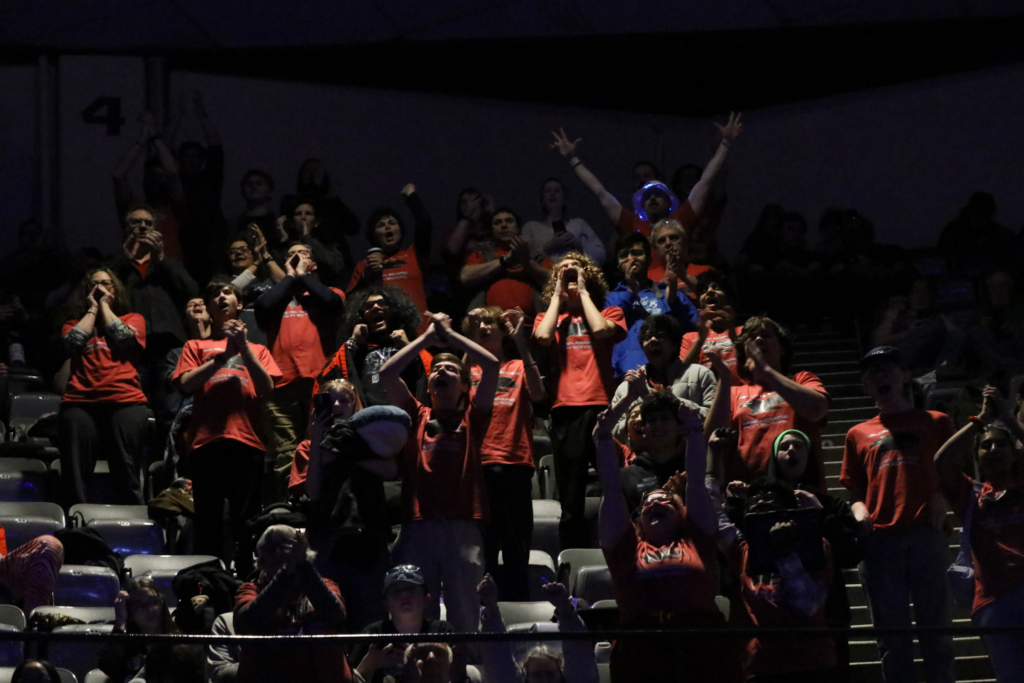 A group of students cheering in the stands