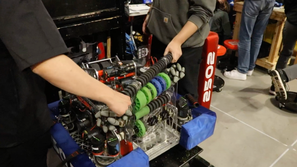 Team members trying to fix the smashed intake