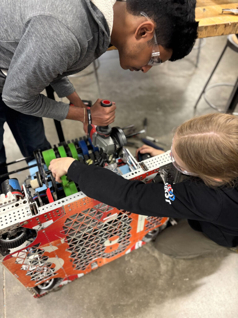Two members of build leadership working on intake